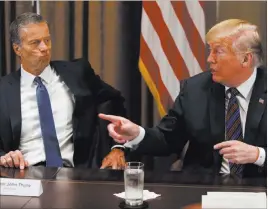  ?? Evan Vucci ?? The Associated Press Sen. John Thune, R-S.D., listens as President Donald Trump speaks Thursday during a meeting with governors and lawmakers in the Cabinet Room of the White House.