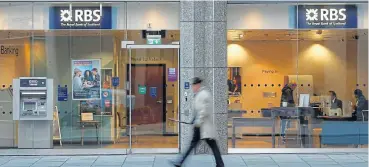  ?? /Reuters ?? Planning: A man walks past a branch of the Royal Bank of Scotland in London. RBS has contacted 15,000 businesses to assess their potential exposures, mapping risks across supply chains.