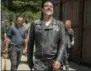  ?? GENE PAGE — AMC VIA AP ?? This image released by AMC shows Jeffrey Dean Morgan as Negan, foreground, from the series, “The Walking Dead.” The popular zombie series makes its midseason returns today on AMC.