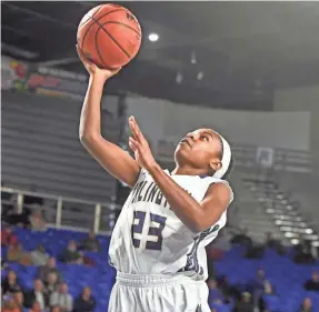  ??  ?? Arlington’s Carmen Taylor (23) goes up for a shot during the 2019 state tournament.