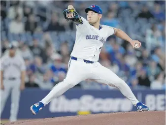  ?? NATHAN DENETTE, THE CANADIAN PRESS ?? Blue Jays starting pitcher Yusei Kikuchi delivers against the Yankees during the first inning in Toronto on Tuesday. Kikuchi went six innings, giving up one run.