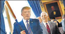  ?? REUTERS ?? Carrot & stick policy: Trump with Vice President Mike Pence