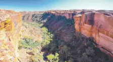  ?? ?? The Northern Territory has a campaign enticing travellers to experience­s such as Kings Canyon.