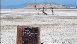  ?? Mark Boster
Los Angeles Times ?? LEGISLATIO­N signed by Gov. Jerry Brown orders the Salton Sea Authority to lead a feasibilit­y study on options for restoring parts of the shrinking desert lake.