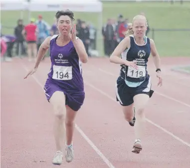  ??  ?? Lori Urban of Coquitlam, left, races against Quesnel’s Libby Sherwood in a 100- metre event at UBC on Saturday. They are preparing for the Special Olympics Canada Summer Games in Vancouver, which runs July 8 to 12.