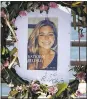  ?? AP FILE PHOTO ?? Flowers and a portrait of Kate Steinle are displayed at a memorial site on Pier 14 in San Francisco in July 2015.