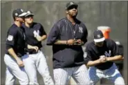  ??  ?? New York Yankees CC Sabathia, center, and his teammates run a drill during a spring training baseball workout Friday, Feb. 17, 2017, in Tampa, Fla. (AP Photo/Matt Rourke)