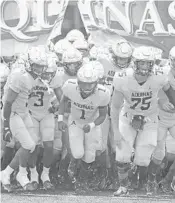  ?? GARY CURRERI/COURTESY ?? St. Thomas Aquinas players run onto the field prior to the Raiders’ 38-23 victory over St. Frances Academy on Saturday afternoon.