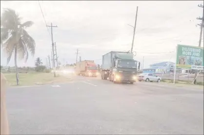  ??  ?? Containers with ballot boxes arriving with speed and under heavy guard at the Arthur Chung Convention Centre on Monday evening as the recounting process was expected to begin