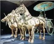  ?? ASSOCIATED PRESS ?? IN A TUESDAY, DEC. 12 PHOTO, a replica of a bronze chariot with horses is part of the Terracotta Army exhibit at the Virginia Museum of Fine Arts in Richmond, Va.