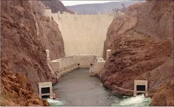  ?? LENNOX MCLENDON — THE ASSOCIATED PRESS ?? Hoover Dam near Boulder City, Nev., in 1998. Americans wondering whether a nearby dam could be dangerous can look up the condition and hazard ratings of tens of thousands of dams nationwide using an online database run by the federal government. But they won't find the condition of Hoover Dam, which impounds one the nation's largest reservoirs on the border of Nevada and Arizona. That's because some agencies have failed to update their data.