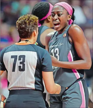  ?? SEAN D. ELLIOT/THE DAY ?? Connecticu­t Sun forward Chiney Ogwumike argues with official Cheryl Flores during play against the Las Vegas Aces on Sunday at Mohegan Sun Arena. The Sun have won five straight heading into tonight’s game at Chicago.