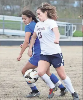  ??  ?? Heritage’s Kynsee Newton (right) fights for control of a loose ball during last week’s match with Northwest Whitfield. (Photo by Scott Herpst)