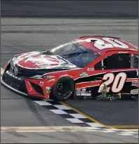  ?? (AP/John Raoux) ?? Christophe­r Bell crosses the finish line to win Sunday’s NASCAR Cup Series race at Daytona Internatio­nal Speedway in Daytona Beach, Fla. It was Bell’s first career Cup victory.