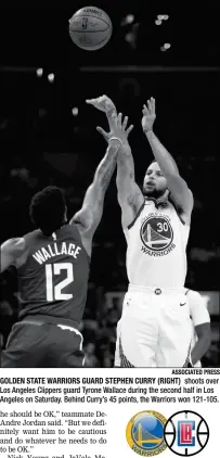 ?? ASSOCIATED PRESS ?? GOLDEN STATE WARRIORS GUARD STEPHEN CURRY (RIGHT) shoots over Los Angeles Clippers guard Tyrone Wallace during the second half in Los Angeles on Saturday. Behind Curry’s 45 points, the Warriors won 121-105.