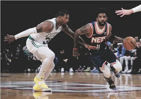  ?? AP PHOTO/JOHN MINCHILLO ?? Brooklyn Nets guard Kyrie Irving (11) drives past Boston Celtics guard Marcus Smart (left) during the first half of Game 4 of an NBA basketball first-round playoff series, in April 25 in New York.