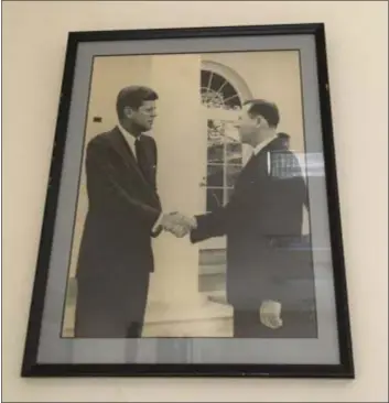  ?? KATHLEEN E. CAREY - DIGITAL FIRST MEDIA ?? This photo of John Reilly meeting President John F. Kennedy hangs in the office of his son, Andy Reilly.