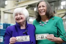  ?? LM OTERO — THE ASSOCIATED PRESS ?? Secretary of the Treasury Janet Yellen, left, and Treasurer of the United States Chief Lynn Malerba show money they autographe­d during a tour of the Bureau of Engraving and Printing’s Western Currency Facility in Fort Worth, Texas, on Thursday.