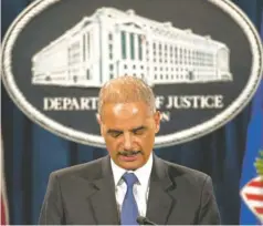  ?? J. SCOTT APPLEWHITE, AP ?? Attorney General Eric Holder answers questions at the Justice Department on May 14 about journalist­s’ telephone records.