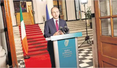  ?? PHOTO: JULIEN BEHAL ?? Good news: Taoiseach Micheál Martin at Government Buildings, Dublin, where he addressed the nation on exiting Level 5 last night.