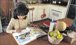  ?? Francine Orr Los Angeles Times ?? ALESSANDRA ALAMILLA, 7, reads at her home in San Bernardino. All of her siblings are focused on academics, and they all want to help their parents.