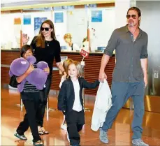  ?? — EPA ?? Happier times: Pitt has said he is unwilling to play dirty in his custody battle with Jolie because he does not want to upset the children.