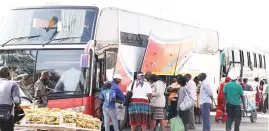  ??  ?? South Africa-bound buses load passengers along George Silundika Street in Bulawayo, thereby disrupting motorists using the street yesterday. The buses need an operating area