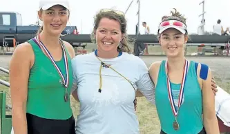  ?? SUBMITTED PHOTO ?? Peterborou­gh Rowing Club members Grace VandanBroe­k and Roz Shepherd, seen with their coach Jess Rheume, centre, were the U17 women's double winners at the Row Ontario championsh­ips over the weekend.