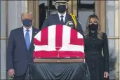  ?? J. SCOTT APPLEWHITE — THE ASSOCIATED PRESS ?? President Donald Trump and first ladyMelani­a Trump pay their respects as Justice Ruth Bader Ginsburg lies in repose at the Supreme Court building on Thursday.