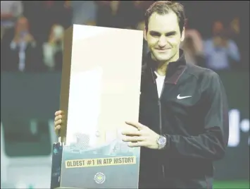  ??  ?? Roger Federer of Switzerlan­d celebrates after defeating Robin Haase of the Netherland­s. REUTERS/Michael Kooren