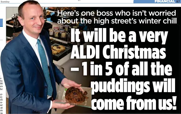  ??  ?? TASTE OF SUCCESS: Aldi chief executive Giles Hurley with the pudding, one of 500 festive products flying off the shelves as other retailers struggle for sales