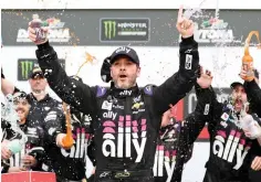  ?? AP Photo/John Raoux, File ?? ■ Jimmie Johnson celebrates in Victory Lane after winning the NASCAR Clash auto race Feb. 10 at Daytona Internatio­nal Speedway in Daytona Beach, Fla. Seven-time NASCAR champion Johnson has twice tested negative for the coronaviru­s and has been cleared to race Sunday at Kentucky Speedway. Johnson missed the first race of his Cup career when he tested positive last Friday.