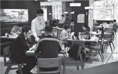  ?? ?? People dine-in at a restaurant in Guangzhou, southern Guangdong Province, yesterday. — CFP