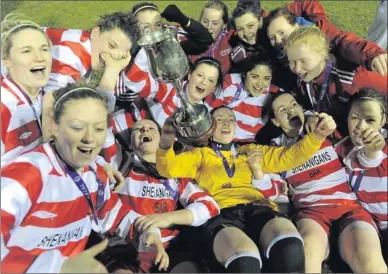  ??  ?? IT Sligo goalkeeper and captain Roisin McCafferty (in yellow) celebrates with the cup alongside her team-mates after their victory in the Premier League final at Deacy Park, Galway.