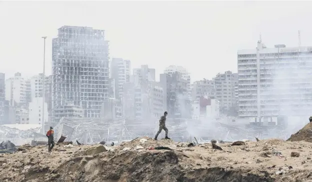  ?? PICTURE: THIBAULT CAMUS/AP ?? 0 A soldier walks at the devastated site of the explosion in the port of Beirut in Lebanon, where 300,000 people are now homeless