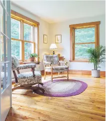  ??  ?? French doors open up into a spacious family room overlookin­g the wooded part of the property renovated by owners Mike Stone and Susan Wallet.