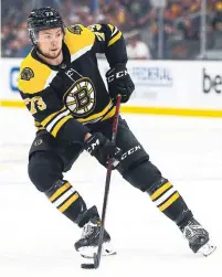  ?? ADAM GLANZMAN GETTY IMAGES ?? A new contract makes defenceman Charlie McAvoy the highest-paid Bruin, passing offensive stars like Patrice Bergeron.