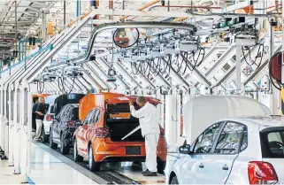  ?? /Bloomberg ?? Revving up: A VW Polo is inspected at the car maker’s plant in Uitenhage. Volkswagen is considerin­g a component assembly plant in Ethiopia.