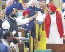  ??  ?? FALLING SHORT OF BLOWS: A video grab of local bodies minister having a heated argument with Akali leader Bikram Majithia during the budget session in the Vidhan Sabha on Monday.