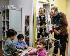  ?? NYT ?? The Elderly and Children Together project, an experiment that seeks to connect the vulnerable at both extremes of life, at a nursing home in Piacenza, Italy. In a demographi­c double whammy, the population of elder Italians is soaring as Italy’s birthrate plummets.