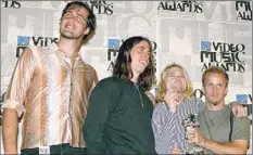  ?? Mark J. Terrill / Associated Press, file ?? Original members of Nirvana, from left are, Chris Novoselic, Dave Grohl, and Kurt Cobain. After Cobain’s suicide, Grohl started Rock & Roll Hall of Fame-nominated Foo Fighters.