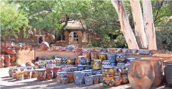  ??  ?? More than 80 art galleries and shops are clustered in the plaza where old adobes, shady courtyards and ocotillo fences blend seamlessly with newer buildings in Tubac.