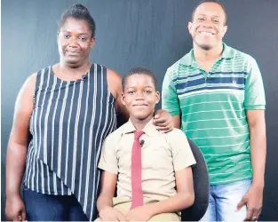  ?? IAN ALLEN/PHOTOGRAPH­ER ?? The Gleaner’s Spelling Bee Champion Deneiro Hines is our hope in the Scripps National Spelling Bee, which gets under way tomorrow in Washington, DC. Here he poses with his mother, Carolyn Williams, and coach, Errol Campbell.