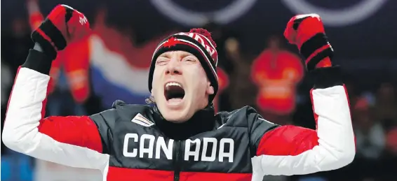  ??  ?? Ted-Jan Bloemen of Calgary exults on the podium after winning the men’s 10,000-metre speedskati­ng race Thursday in record time at the Gangneung Oval.