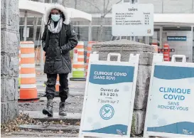  ?? GRAHAM HUGHES THE CANADIAN PRESS ?? A woman leaves a COVID-19 testing clinic in Montreal on Sunday. Quebec health authoritie­s recorded 1,211 new cases and 15 additional deaths linked to the virus.