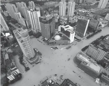  ?? ASSOCIATED PRESS ?? An aerial view shows flooded intersecti­ons following the landfall of typhoon Megi in Fuzhou in southeaste­rn China's Fujian Province, Wednesday, when it made landfall, a day after carrying strong winds over Taiwan that felled trees and scattered debris,...