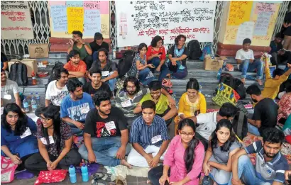 ?? PTI ?? Students stage a sit-in protest at Jadavpur University against its decision to scrap entrance test for six undergradu­ate courses, on the campus of the university, in Kolkata on Saturday. —
