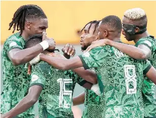  ?? ?? Super Eagles celebrate after scoring against the Palancas Negras of Angola yesterday