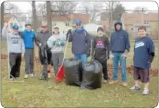  ??  ?? Players, coaches and parents raked leaves and prepared one of the fields for opening day scheduled for April 6.