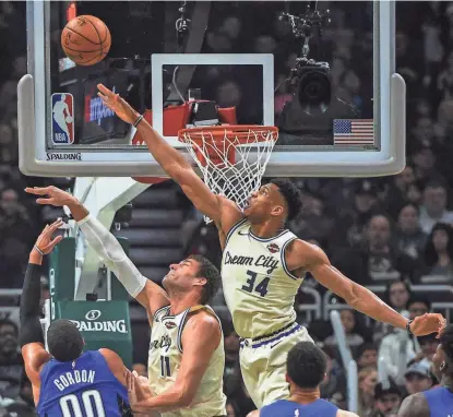  ?? BENNY SIEU / USA TODAY SPORTS ?? The Bucks’ Giannis Antetokoun­mpo earned 75 out of 100 first-place votes for defensive player of the year. He is the fifth player to be MVP and DPOY in his career.